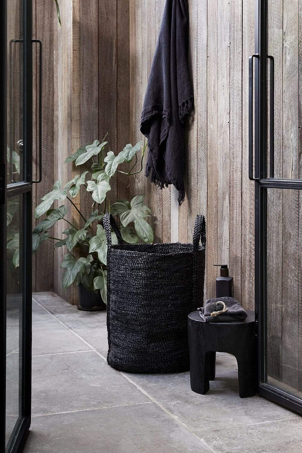 The Dharma Door Baskets and Storage jute handwoven handmade fairtrade Laundry Basket - Charcoal in bathroom interior